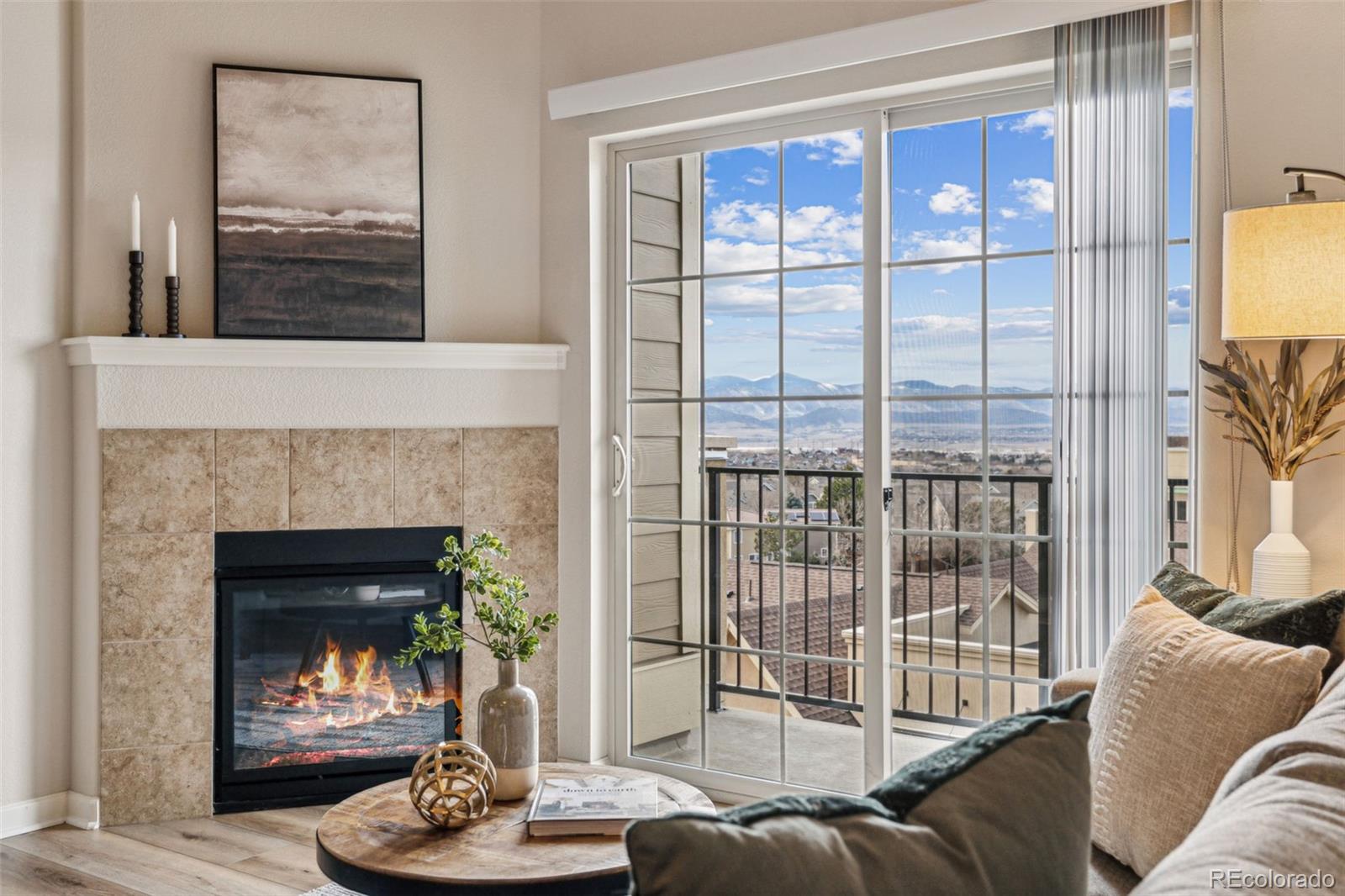 1062 Rockhurst Drive, Unit 401 Highlands Ranch, CO 80129 - Photo 8 of 41 a living room with furniture and a fireplace