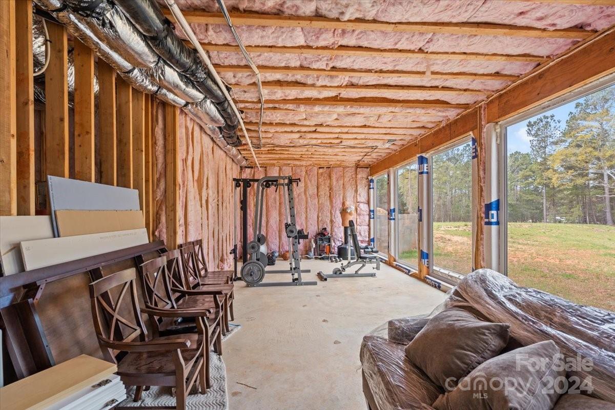 11086 Caroline Acres Road Indian Land, SC 29707 - Photo 37 of 47 a bed room with furniture and large windows