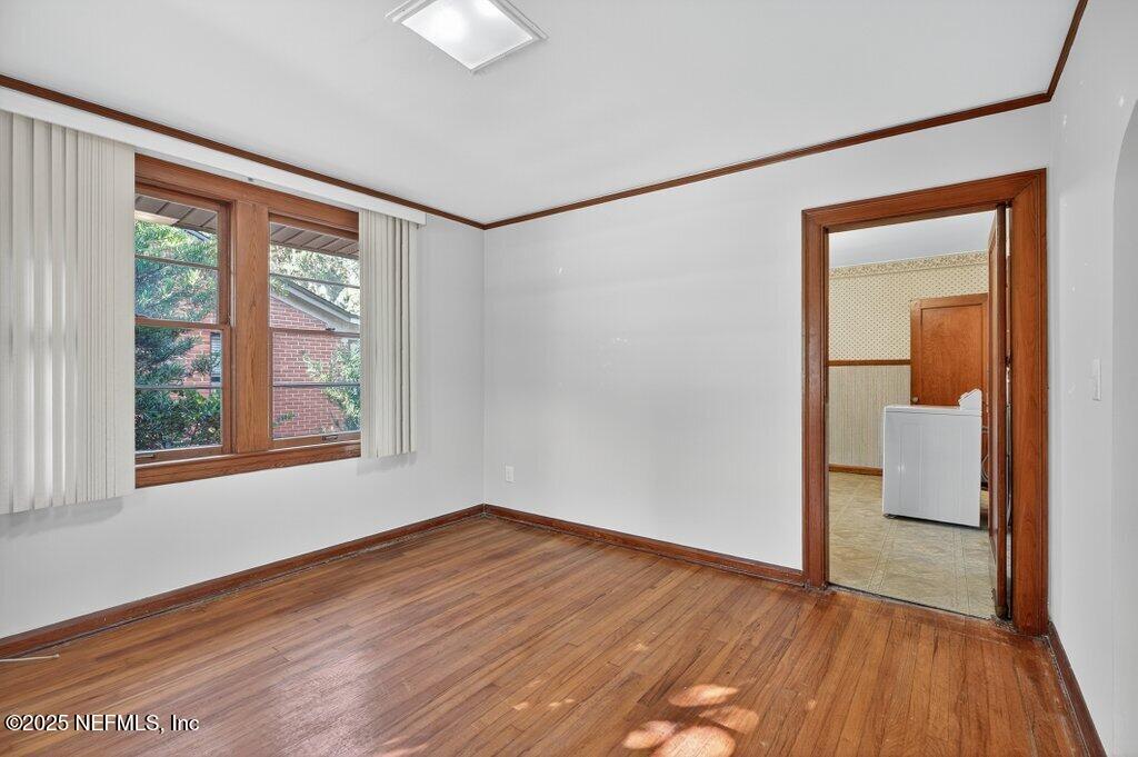 1111 Inwood Terrace Jacksonville, FL 32207 - Photo 16 of 46 a view of empty room with wooden floor and fan