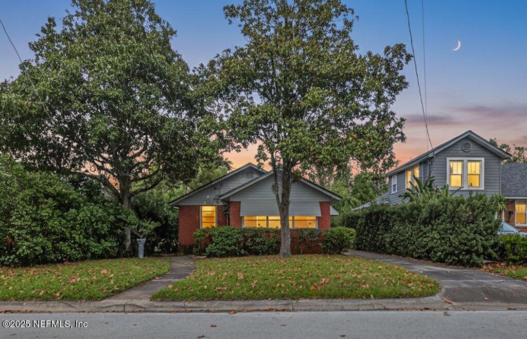 1111 Inwood Terrace Jacksonville, FL 32207 - Photo 2 of 46 a front view of a house with a yard and garage