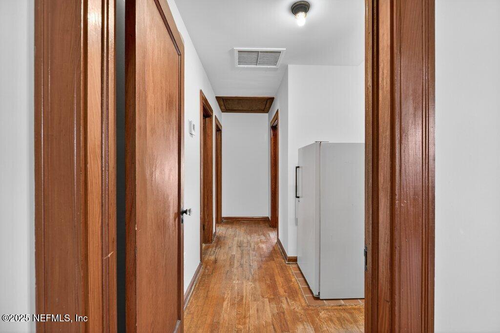 1111 Inwood Terrace Jacksonville, FL 32207 - Photo 26 of 46 a view of a hallway with wooden floor
