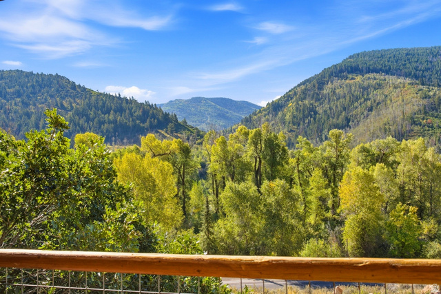 2640 East Weber Canyon Road Oakley, UT 84055 - Photo 56 of 56 Mountainous terrain, expansive greenery, natural wood railing, wire mesh fencing, clear sky