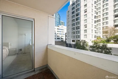 a picture of a building with sitting area