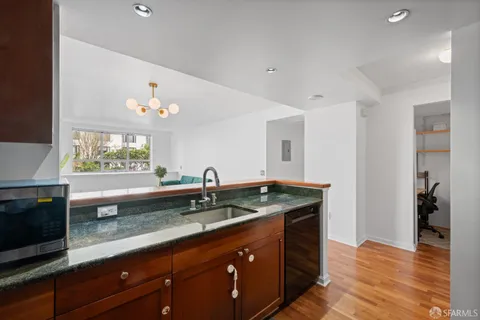a kitchen with a sink and a microwave