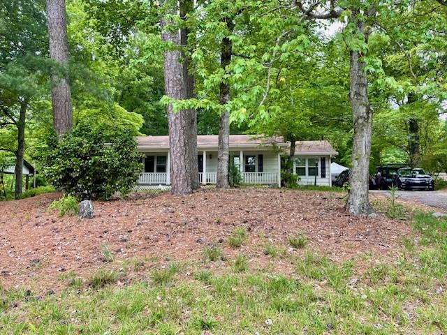 1560 Rucker Road Alpharetta, GA 30009 - Photo 1 of 1 a view of a house with a yard and tree s