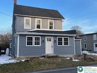 a front view of a house with garage