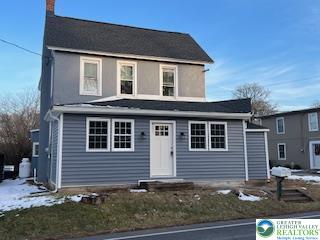 1924 Rt 212, Unit A Quakertown, PA 18951 - Photo 1 of 23 a front view of a house with garage