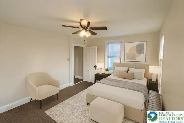 a bedroom with a bed and a couch