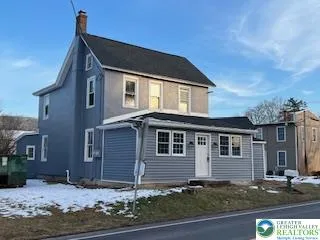 a front view of a house with garage