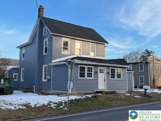 1924 Rt 212, Unit A Quakertown, PA 18951 - Photo 2 of 23 a front view of a house with garage