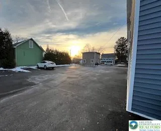 a view of a parking space with a car parked in front of it