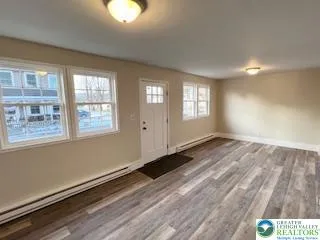 a view of an empty room and window