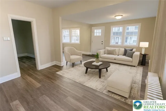 a living room with furniture and a window