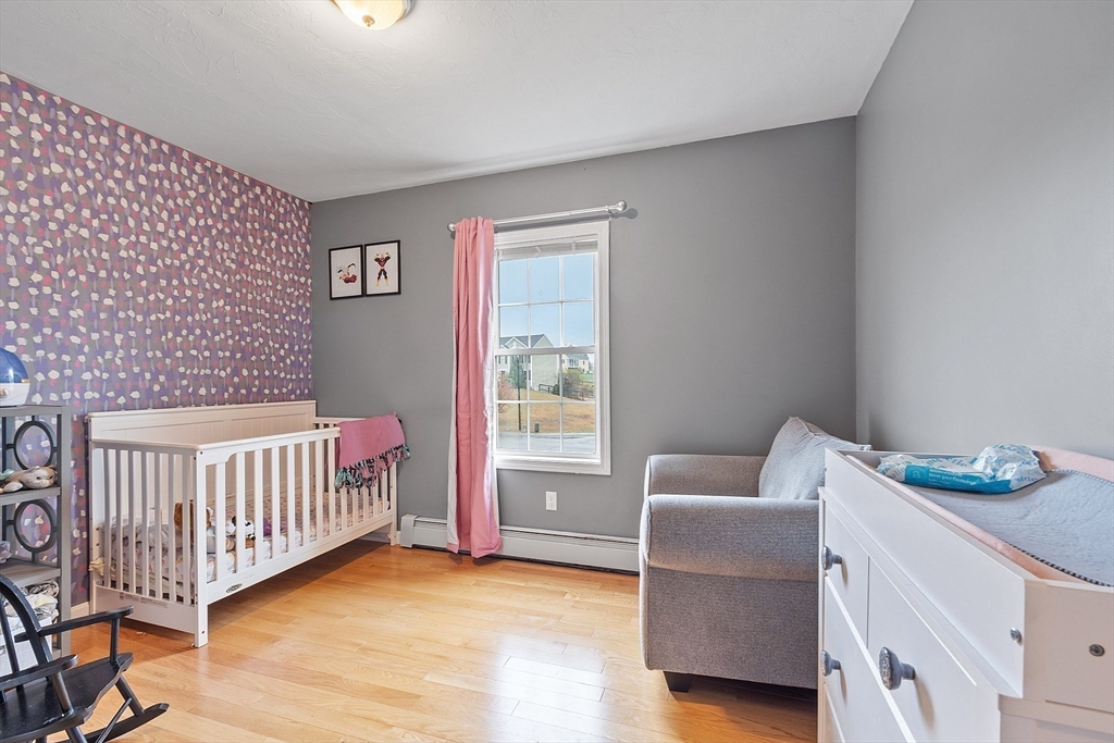 3 Gary Road Templeton, MA 01468 - Photo 12 of 22 a bedroom with a baby bed a couch and a window