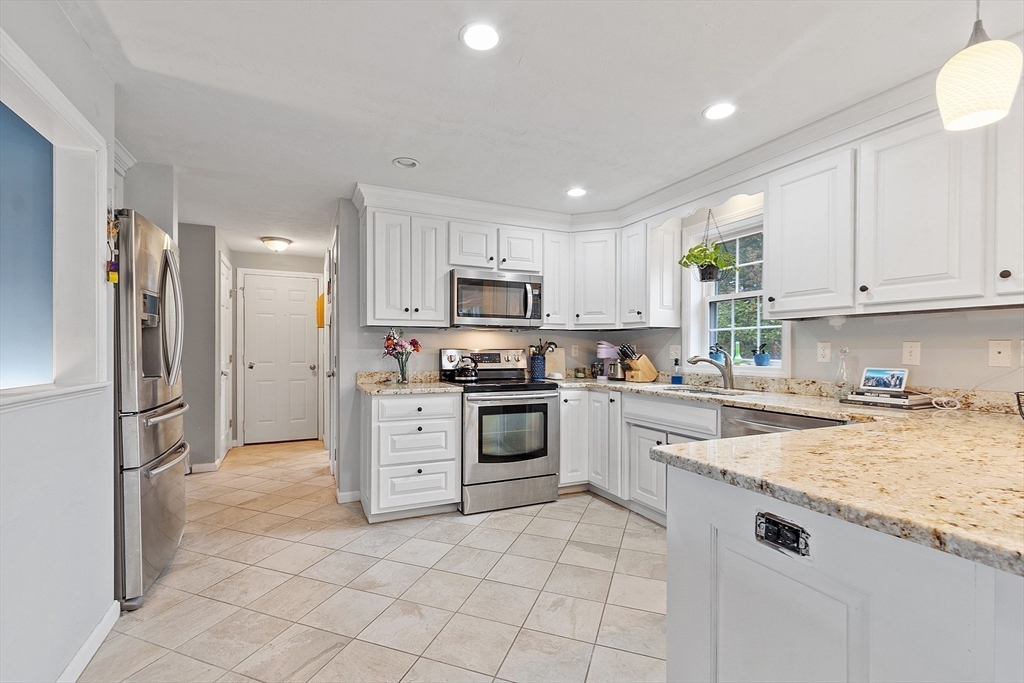 3 Gary Road Templeton, MA 01468 - Photo 5 of 22 a kitchen with granite countertop a refrigerator stove top oven and sink