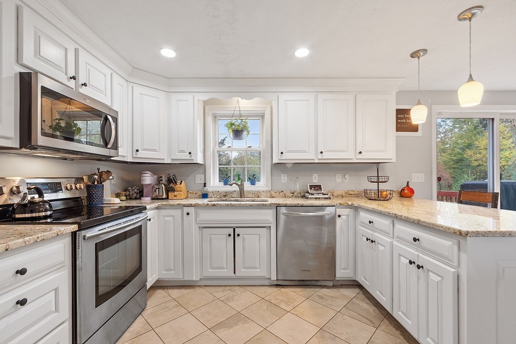 3 Gary Road Templeton, MA 01468 - Photo 6 of 22 a kitchen with stainless steel appliances granite countertop a sink and cabinets with wooden floor
