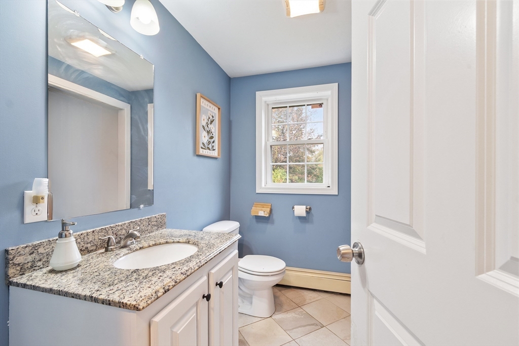 3 Gary Road Templeton, MA 01468 - Photo 8 of 22 a bathroom with a granite countertop sink a toilet and a mirror