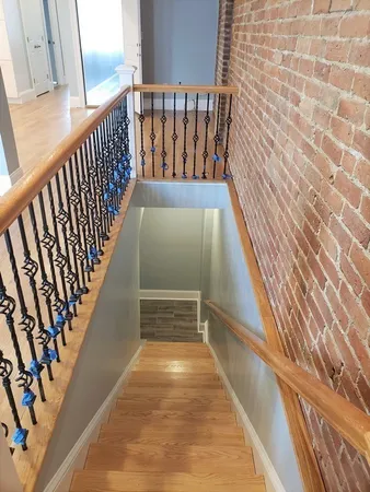 a view of balcony with wooden floor
