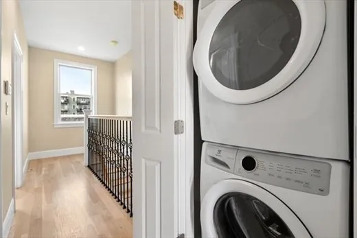 a view of a hallway with washer and dryer