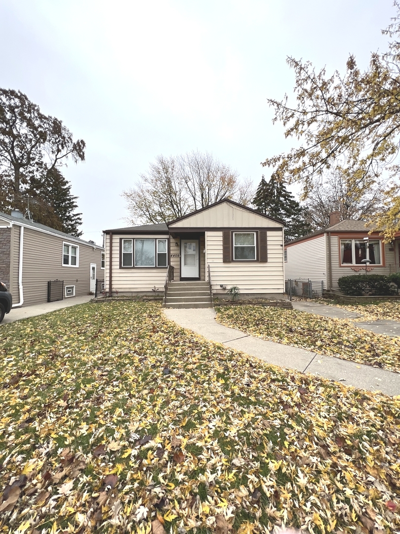 front view of a house with a yard
