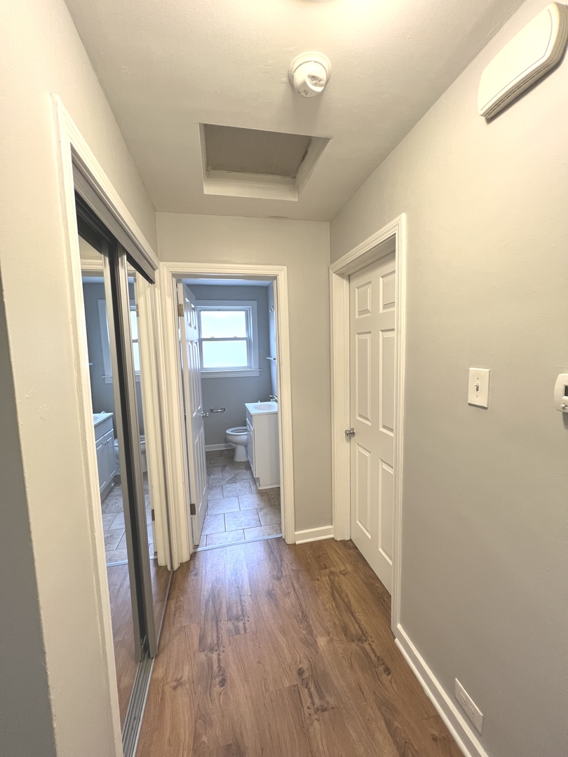 4409 Home Avenue Stickney, IL 60402 - Photo 12 of 21 a view of a hallway with wooden floor