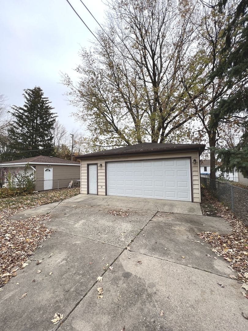4409 Home Avenue Stickney, IL 60402 - Photo 21 of 21 a house that has a tree in front of it
