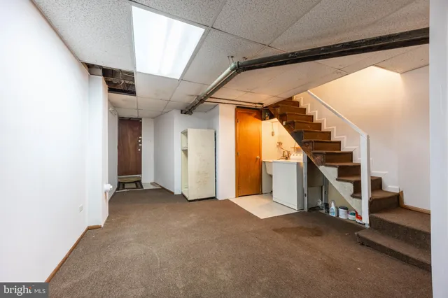 a view of an empty room with stairs