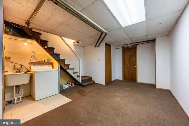 a view of an empty room with stairs