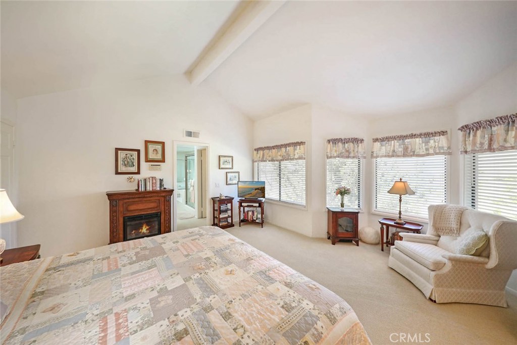 4 Lucerne, Unit 22 Newport Beach, CA 92660 - Photo 12 of 20 a spacious bedroom with a bed and a couch