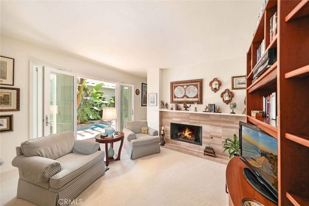 4 Lucerne, Unit 22 Newport Beach, CA 92660 - Photo 15 of 20 a living room with furniture and a fireplace