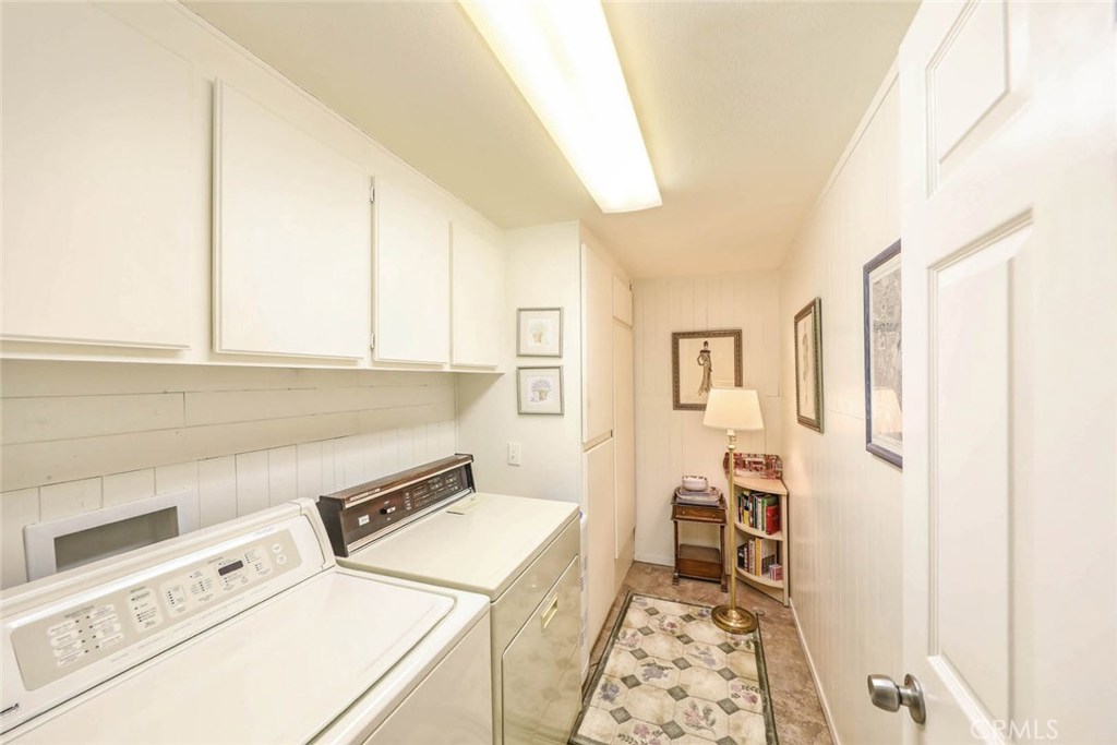 4 Lucerne, Unit 22 Newport Beach, CA 92660 - Photo 17 of 20 a utility room with dryer and washer