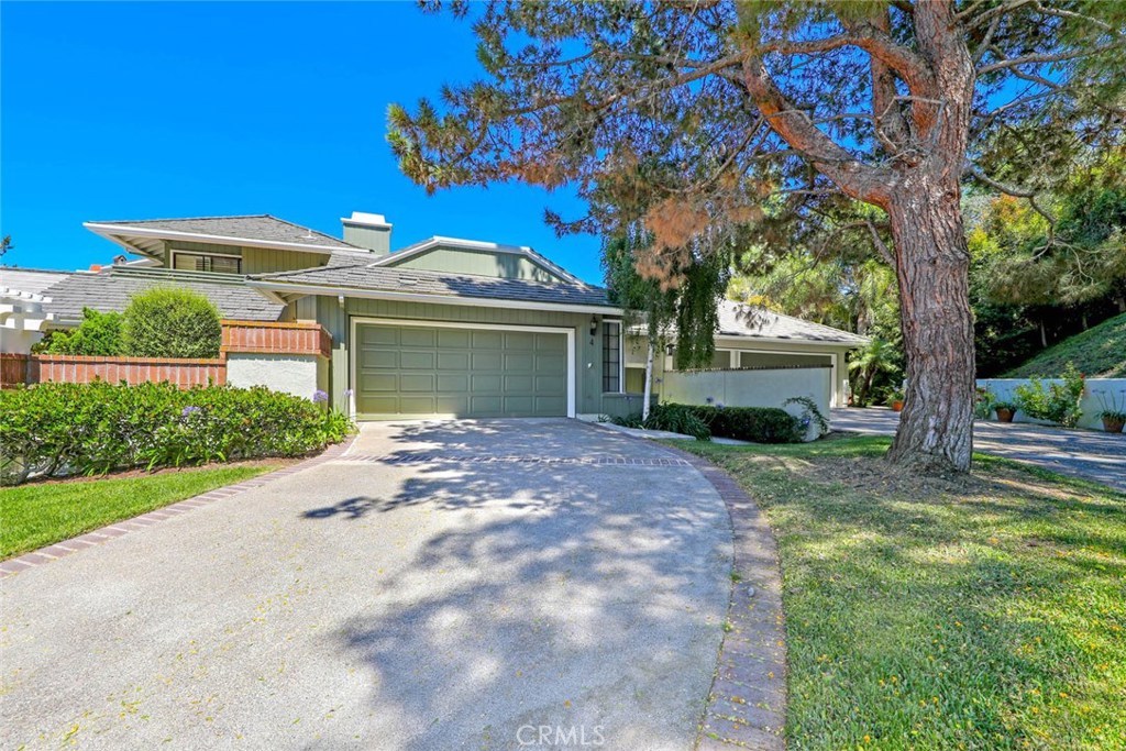 4 Lucerne, Unit 22 Newport Beach, CA 92660 - Photo 3 of 20 a view of a house with a tree and a yard