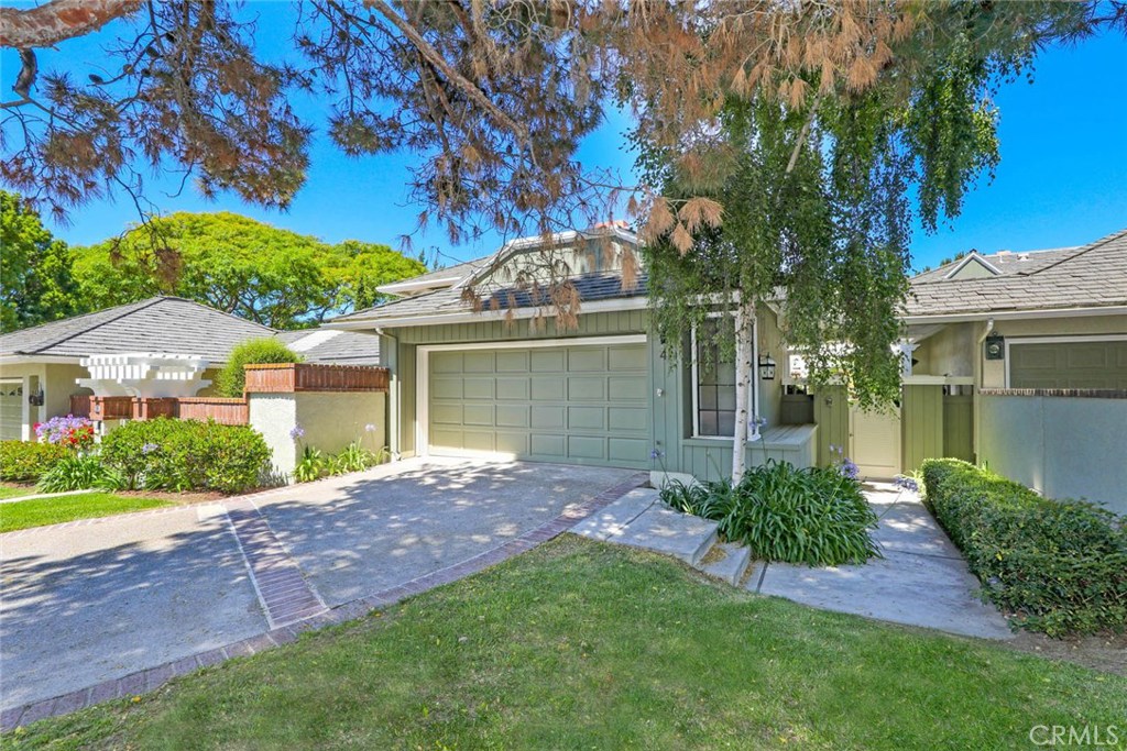 4 Lucerne, Unit 22 Newport Beach, CA 92660 - Photo 4 of 20 front view of a house with a yard