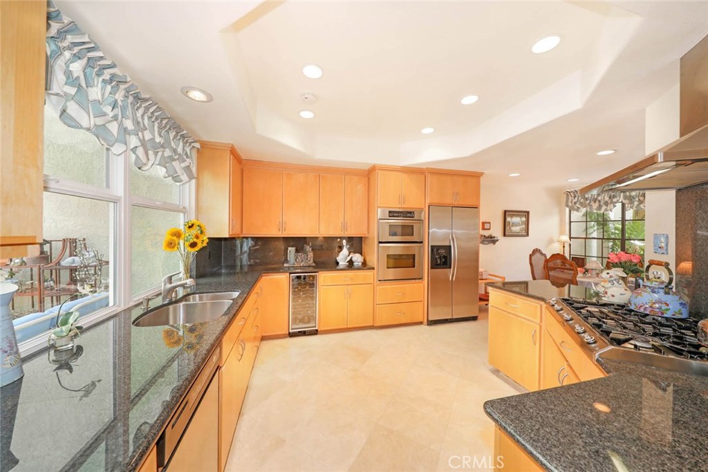 4 Lucerne, Unit 22 Newport Beach, CA 92660 - Photo 7 of 20 a large kitchen with lots of counter space