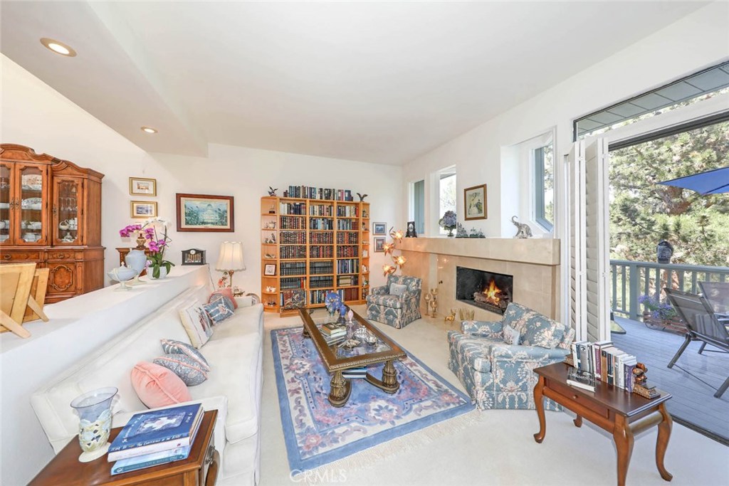 4 Lucerne, Unit 22 Newport Beach, CA 92660 - Photo 9 of 20 a living room with furniture a rug and a large window