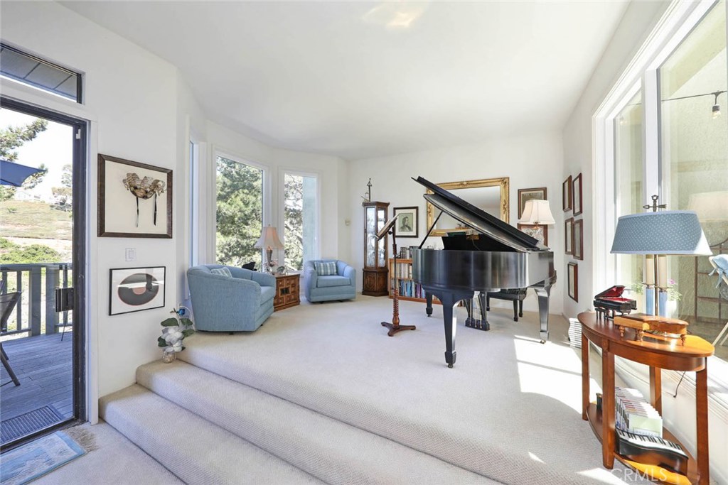 4 Lucerne, Unit 22 Newport Beach, CA 92660 - Photo 10 of 20 a living room with furniture and a lamp