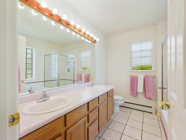 a bathroom with a sink a vanity and a mirror
