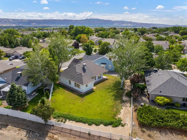 an aerial view of a house with a garden