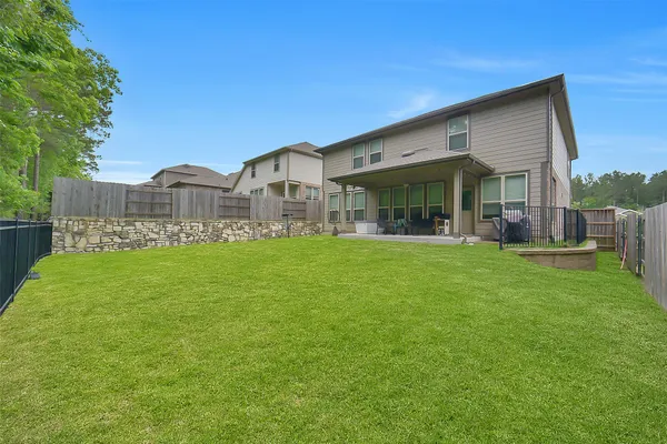a front view of building with yard and green space