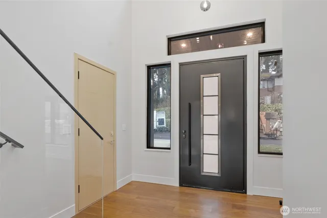 a view of an entryway with wooden floor