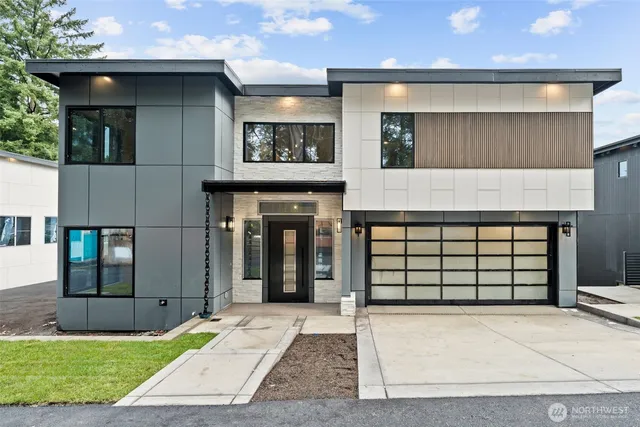a front view of a house with a garage