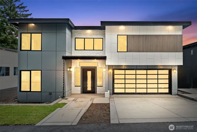 a front view of a house with a garage