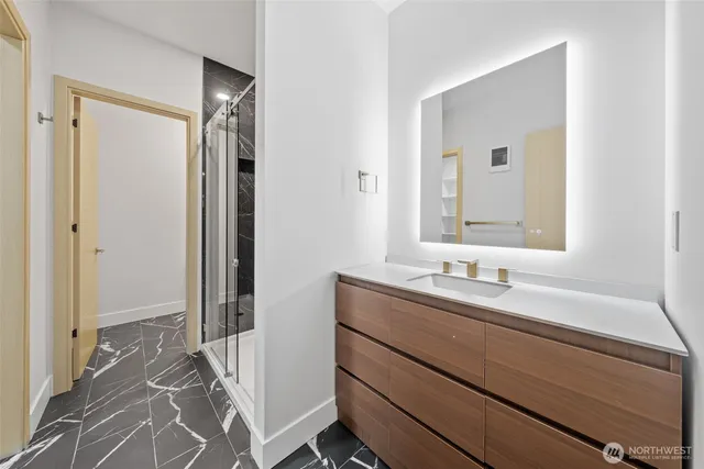 a bathroom with a sink and a mirror