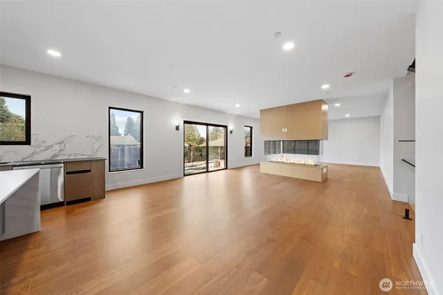 a view of a kitchen with a sink and a stove top oven