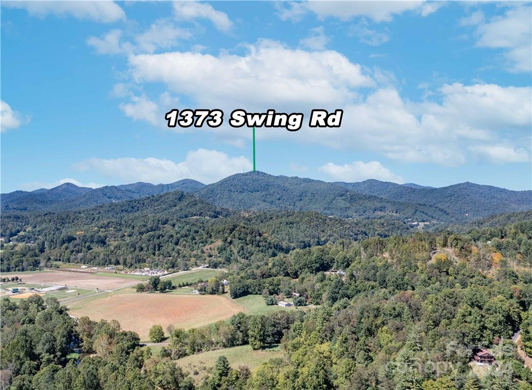 1375 Swing Road Burnsville, NC 28714 - Photo 16 of 48 a view of a area with mountains and valleys in the background