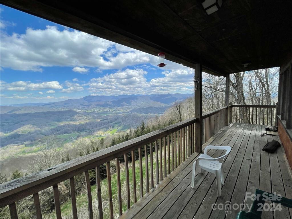1375 Swing Road Burnsville, NC 28714 - Photo 23 of 48 a view of balcony with wooden floor & fence