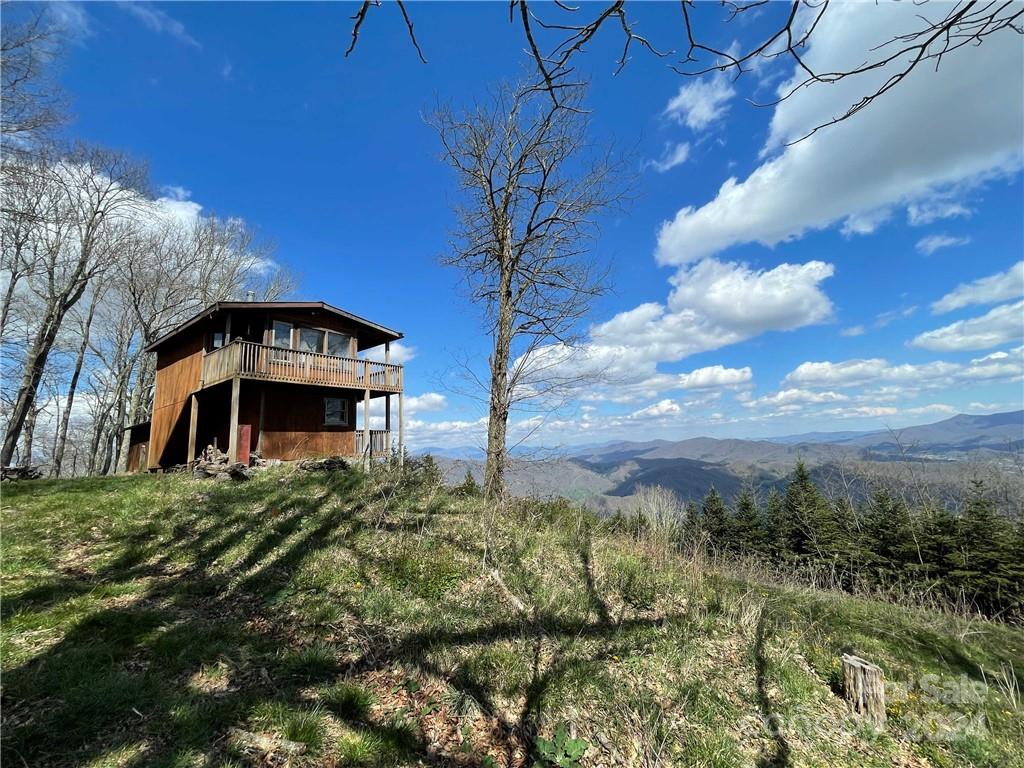 1375 Swing Road Burnsville, NC 28714 - Photo 25 of 48 a view of a house with a yard