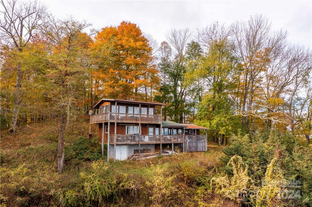 1375 Swing Road Burnsville, NC 28714 - Photo 3 of 48 a view of a house with a yard
