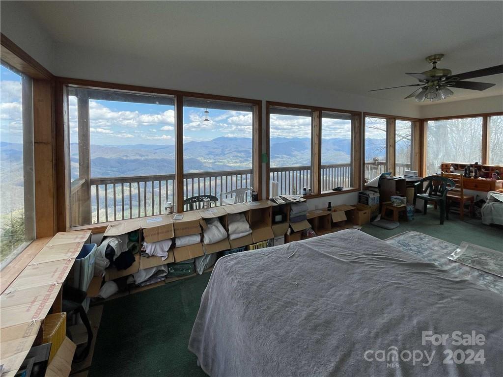 1375 Swing Road Burnsville, NC 28714 - Photo 34 of 48 a living room with furniture and a large window