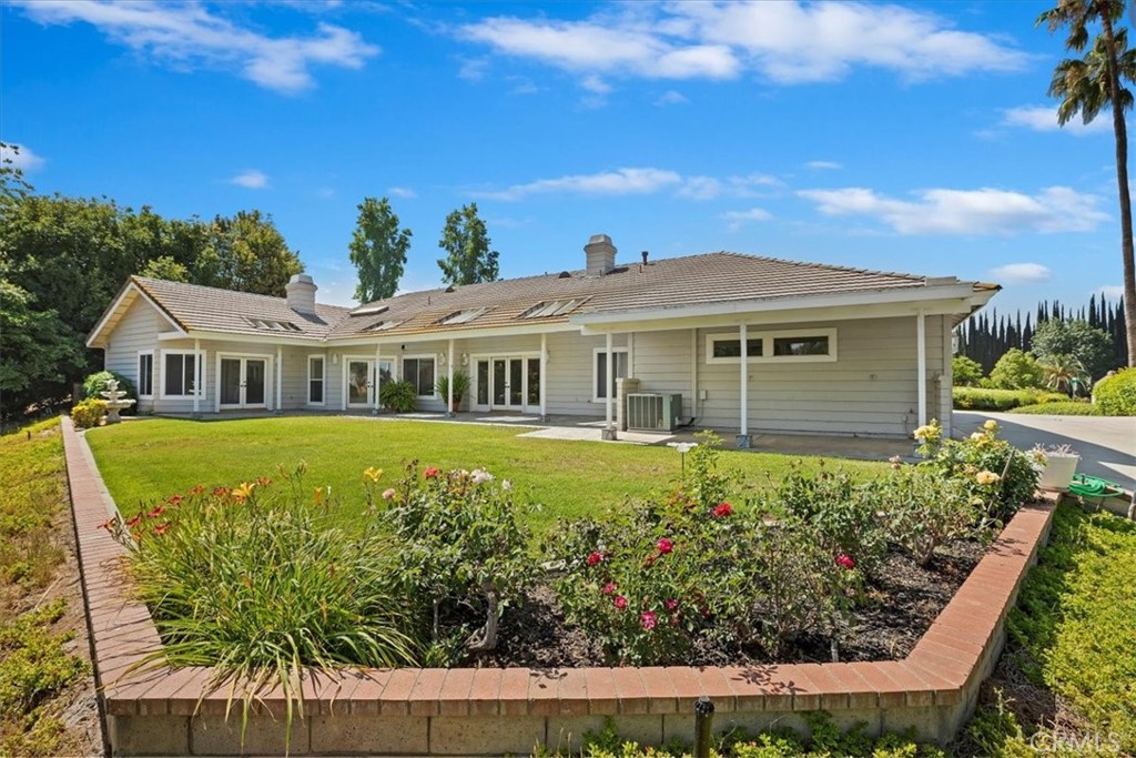 1507 Weston Way Riverside, CA 92506 - Photo 47 of 55 a front view of a house with a garden